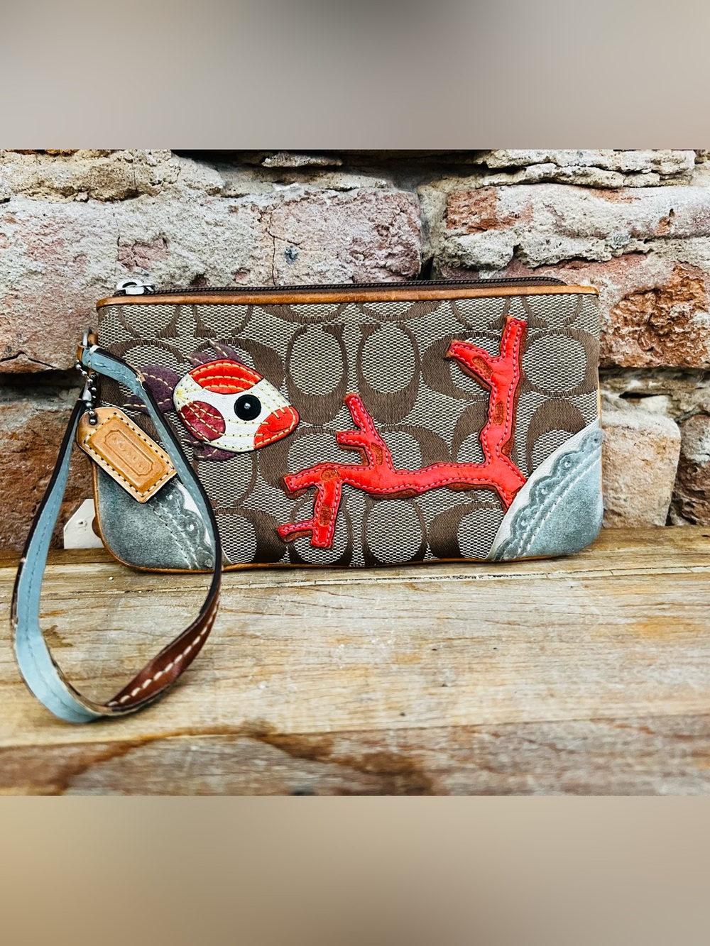 Coach Brown Signature Canvas Wristlet with Red Coral & Multicolor Fish Appliqué